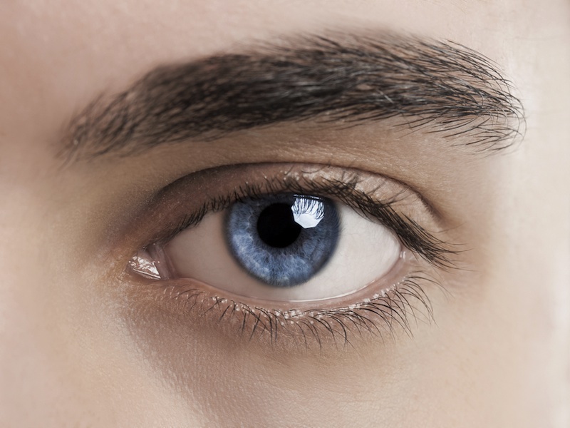 Close-up of human eye with retina illustration