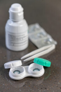 Contact lens case and solution on a bathroom counter